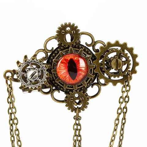 Get That Giddy Up With This Antique Gold Convertible Mechanical Gear Hair Jewelry Pin featuring intricate mechanical detailing and a central red eye.