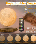 Levitating Moon Lamp With Remote, 6 Inch Floating 3D LED Moon Light With 18 Colors, Magnetic Spinning Base next to sleeping woman