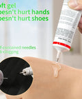 Heavy Duty Shoe Glue For All Shoes, Clear Waterproof Sole Repair Adhesive being applied with needle for precision.
