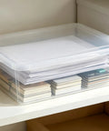 Heavy Duty Clear Plastic Storage Bins Are The Real Deal With Secure Snap Top Lid Stackable Under Bed Totes 28 Quart Low Profile containing papers and postcards.