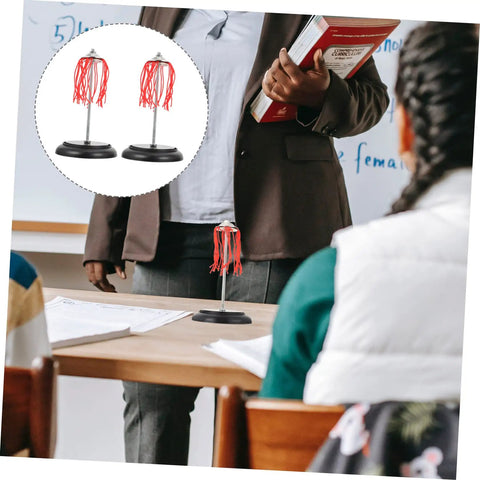Electric Plume Physics Teaching Kit For Electrostatics Learning Two Pack on classroom table, teacher holding book