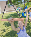 Child playing on 3 Pack Ninja Monkey Bars Obstacle Course Set With Wood And Rope Trapeze Swing Attachments 250 Lb Capacity Built Tough For Backyard Ninja Line Slackline Training For Kids And Teens Black