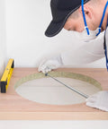 User measuring a round cutout with the 3 Pack Telescoping Measuring Stick Tap Measure Set With Long Extension Pole Reaching 94 Inches Plus Mini Ruler Quick Measurements In Any Tight Squeeze Super Handy Woodworking And Diy Renovation Tool Kit.