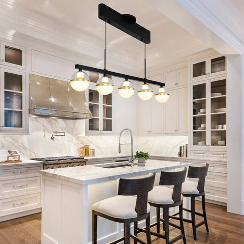 32 Inch Wide Modern LED Kitchen Island Pendant Light Five Light Kit in black and gold finish over a white kitchen island.