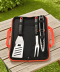 Heavy Duty 4 Piece Barbecue Tools Set With Stainless Steel Spatula Fork And Tongs Plus Free Portable Storage Bag displayed outdoors