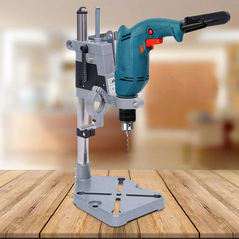 Kickass Adjustable Drill Press Stand Featuring Universal Bench Clamp And Dual Drill Mount with a drill on a wooden table.