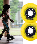 Yellow inline skate wheels 85A 72mm and 76mm set for outdoors and indoors next to a child skating, featuring tough PU material.