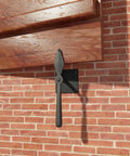 7 Inch Black Spoon Shaped Wrought Iron Shutter Dogs With Mounting Hardware Pack Of 6 for Exterior Shutters on brick wall