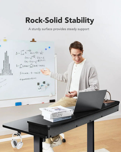 Person using Electric Standing Desk With Two Drawers And Open Storage, 48 By 24 Inch Sit Stand Desk, black, with laptop