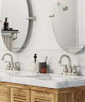 Bathroom with Banbury Brushed Nickel Towel Ring, 6 Inch Aluminum Ring with Zinc Post, wall-mounted next to two mirrors.