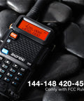 Close-up of Six Pack GT5R Ham Radios Handheld Dual Band Two Way Radios FCC Compliant resting on black pebbles.