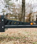 Side view of Skid Steer Sod Roller with Adjustable 36in 44in 52in Widths, Universal Quick Tach for landscaping use.