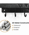 Close-up of Dope Black Stainless Steel Key Holder With Shelf Wall Mount No Drill Self Adhesive Hooks Rack, showing metal construction and hooks.