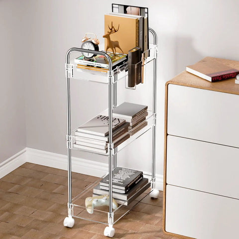Clear 3 Tier Acrylic Rolling Storage Cart With Four Extension Poles For Tall Items And Bottles Laundry Room Bathroom Office Or Living Room Organization Mobile Multifunction Shelving Unit next to a white dresser in a room corner.