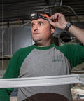 Person wearing Rechargeable LED Headlamp With Adjustable Fabric Strap And Marker Holder For Work And Outdoors