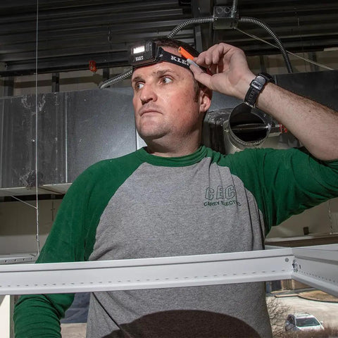 Person wearing Rechargeable LED Headlamp With Adjustable Fabric Strap And Marker Holder For Work And Outdoors