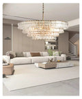 Next Level French Gray Glass Ceiling Pendant Light Sleek Round Chandelier With Dreamy Warm Ambiance in modern living room setting.