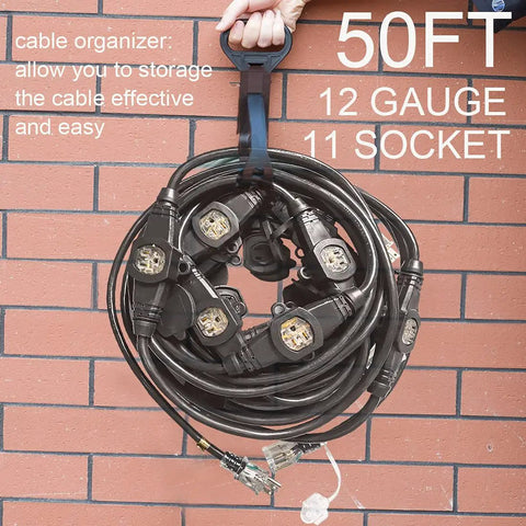 Beefy 50ft 12 Gauge Outdoor Extension Cord with eleven outlets coiled for storage against a brick wall.