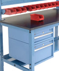 Hardcore Heavy Duty Workbench 60X36 Inches With Adjustable Steel Legs And Tough Phenolic Resin Safety Edge showing tool drawers and red storage bins.