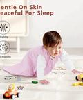 Baby in pink All Cotton Baby Sleep Sack 0 To 6 Months TOG 0.5 Wearable Blanket Three Pack With Two Way Zipper playing on floor
