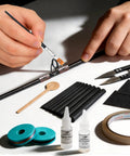 Hands using All-In-One Pro-Grade Fishing Rod Repair Kit With 8 Double-Foot Guides and 9 Tip Sizes, Epoxy Glue, Thread, Tools.