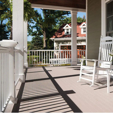 Patio with white railing and furniture painted with Tough Shield Floor And Patio Paint Gray Pear 1 Gallon Waterborne Acrylic Enamel.