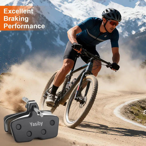 Cyclist using Pro Grade Mountain Bike Disc Brake Pads Set with installation tools; semi-metallic and organic resin pads shown.
