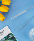 Four Piece Long Tube Brush Set For Cleaning Feeding Tubes And Straws 32 Inches Reach Nylon Bristles Soft Head Great For Narrow Passages And Stubborn Residue Easy Reach Cleaning Tool, long tube brush on blue background