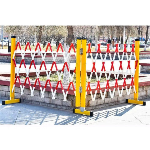 Heavy Duty Expandable Traffic Fence Slick Rolling Pedestrian Safety Barrier with red and white stripes in a park setting.