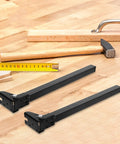 Foldable Metal Table Legs With Self Locking Hinges And Triangular Reinforced Steel Tubing on wooden surface with tools