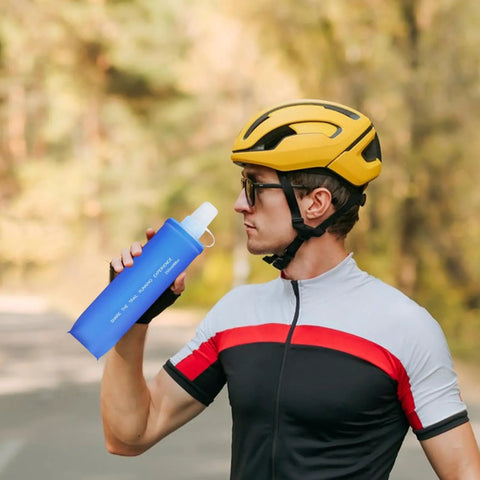 Cyclist using Ultra Lightweight Foldable Water Bottle For Hiking And Outdoor Adventures, Reusable Pouch With Food Grade TPU