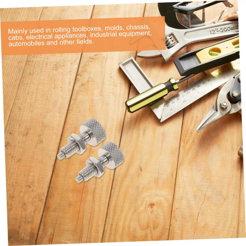 Built Like A Tank Locking Spring Plunger Pins For Rolling Toolboxes Stainless Steel pins on wooden surface with tools
