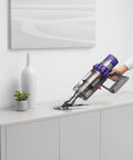 Cyclone V10 Animal Cordless Vacuum Cleaner With Quick Release Extension Hose Stubborn Dirt Brush cleaning top of cabinet