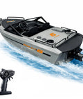Jet Propulsion RC Boat With Brushless Motor For Beginners A Mini Yacht Style Remote Control Boat For Kids Waterproof Electric Boat For Pool Lake And River Grey shown on water