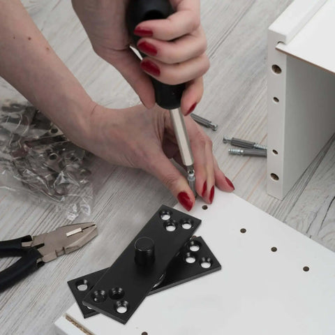 Installing Heavy Duty 360 Degree Stainless Steel Hidden Door Hinge on cabinet with screwdriver and tools visible