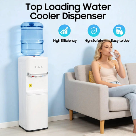 Hot And Cold Water Cooler Dispenser For 5 Gallon Bottle With Top Loading Design next to woman on sofa