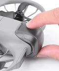 Finger attaching drone lens cover from Drone Lens Cover Set For DJI NEO 2, 2 Pack Gimbal Protector Caps, Anti Scratch Dustproof