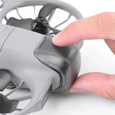 Finger attaching drone lens cover from Drone Lens Cover Set For DJI NEO 2, 2 Pack Gimbal Protector Caps, Anti Scratch Dustproof