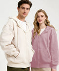 Man and woman wearing zip up hoodie with built in eye mask and multi pockets for travel unisex fleece sweatshirt airplane mode hoodie