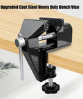 Heavy Duty Mini Work Bench Vise With Adjustable Quick Release Clamp for securing materials on a wooden table.