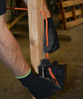 Person installing SIMpull Solid Indoor NM-B Cable 10/2 With Ground Copper Wire for DIY home wiring, connecting to outlet box