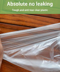 Hands stretching a Heavy Duty Disposable Painter Drop Cloths 9x12 Feet Waterproof Clear Plastic Tarp demonstrating durability.