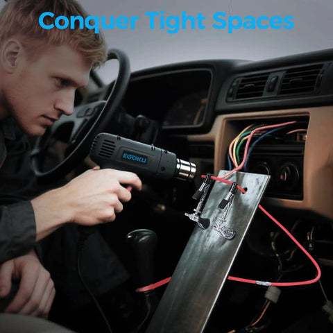 Man using heat gun near wires inside car, illustrating use of Helping Hands Soldering Station With Rock Solid 3.9 Inch Base.