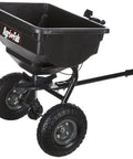 Tow Behind Lawn Spreader With 85Lb Rustproof Poly Hopper And Spreader Plate, black design with pneumatic tires, side view