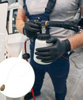 Heavy Duty Rotatable Flexible Air Blower Hose Kit For Car Maintenance And Washing held by technician, featuring spray nozzle and bottle.