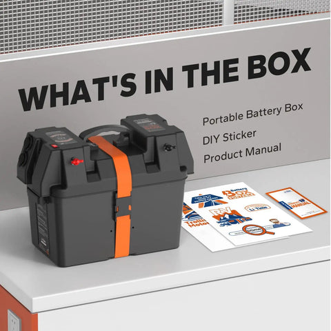 Heavy Duty Slick Smart Battery Box Fits Group 24 27 And 31 Cells Built In 12V Outlet on a table with manuals and stickers.