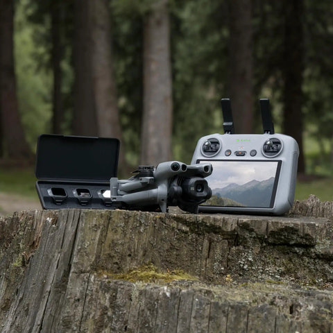 Mini 5 Pro Fly More Combo Plus With RC 2 Drone on log with controller, Ultra Light Pocket Sized Folding Quad in forest setting.