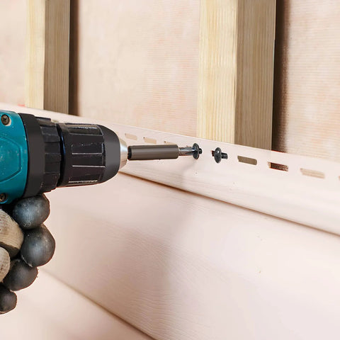 Close-up of Premium Black Wood Screws Set 1-1/2 Inch used with drill for fastening wood, showing Phillips truss head and self-tapping action.