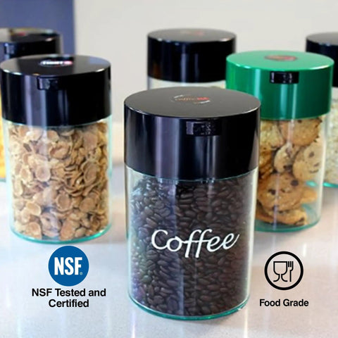 Airtight Vacuum Coffee Canister With Black Cap And Body, 1.85 Liter Smell Proof Storage Jar containing coffee beans, on a countertop