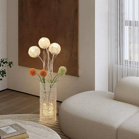Pastoral LED Floor Lamp With Handwoven Rattan Flower Shade, modern cozy vibe lamp in living room with beige sofa.